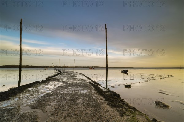 View of causeway and slipway at sunrise