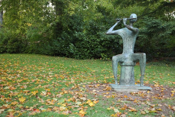 Sculpture Flute Player by Walter Wadephul 1965 in the spa garden Wiesbaden