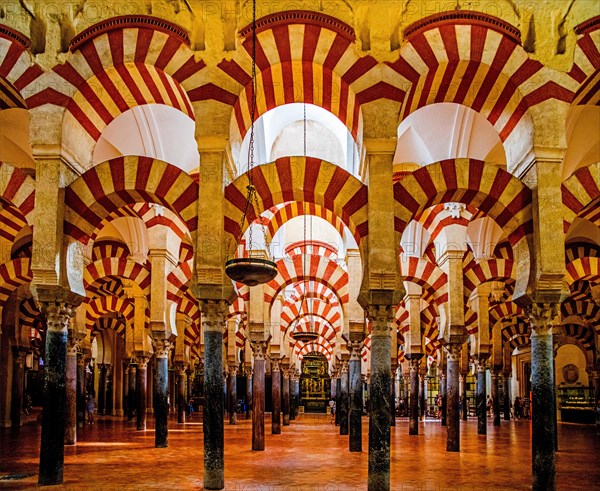 Forest of columns with alternating use of brick and stone and red and white paint