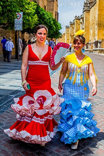 Women in flamenco costumes at the folk festival