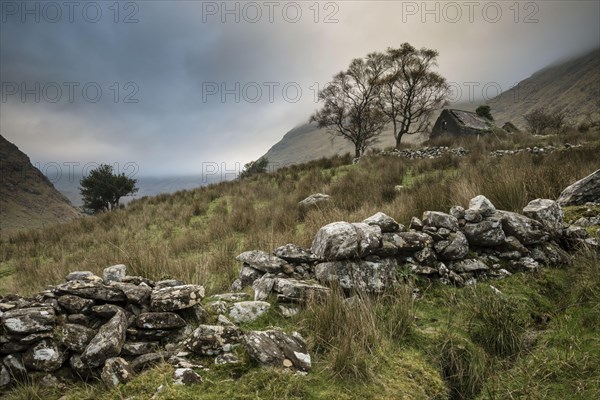 View of drystone walls and abandoned farmhouse