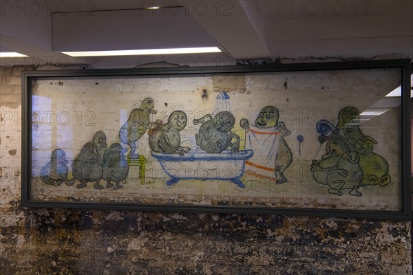 Mural of prisoners in the former potato peeling cellar of the camp kitchen