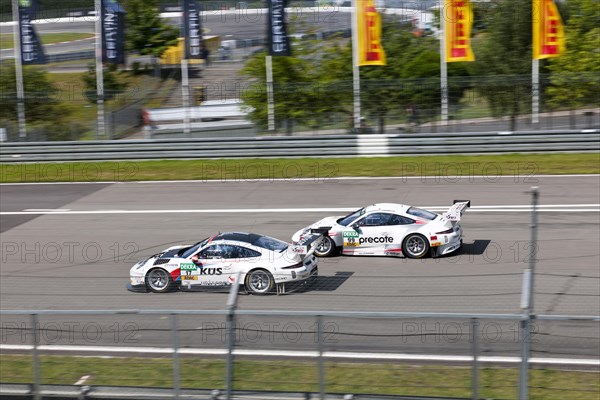 Two Porsche GT3s battle it out at Nuerburgring race track