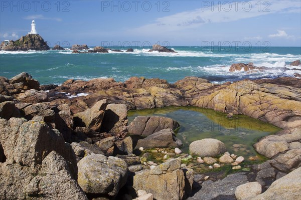 Rock pool on rocky coast at low tide