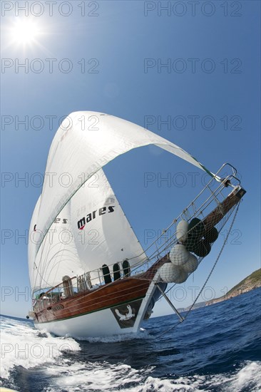 Sailing ship under full sail