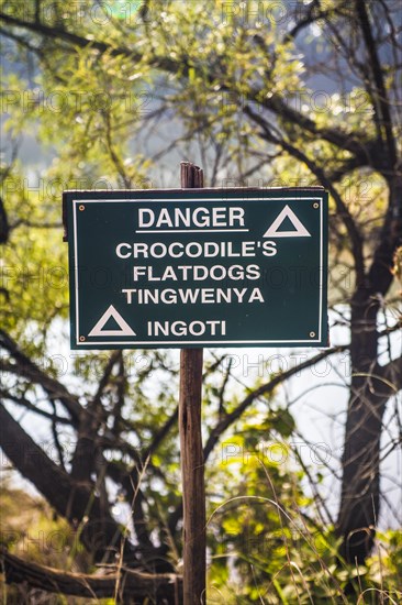 Warning sign against crocodiles