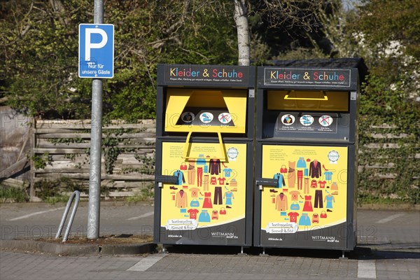 Used clothing container for clothes and shoes in a car park