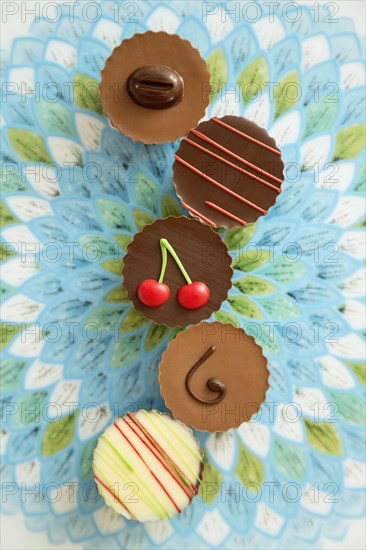 Colorful chocolate assortments on a ceramic plate