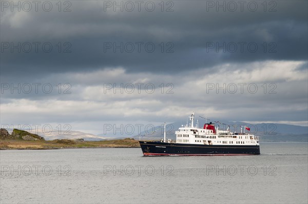 Cruise ship Hebridean Princess sails past the island on her way into Oban Harbour