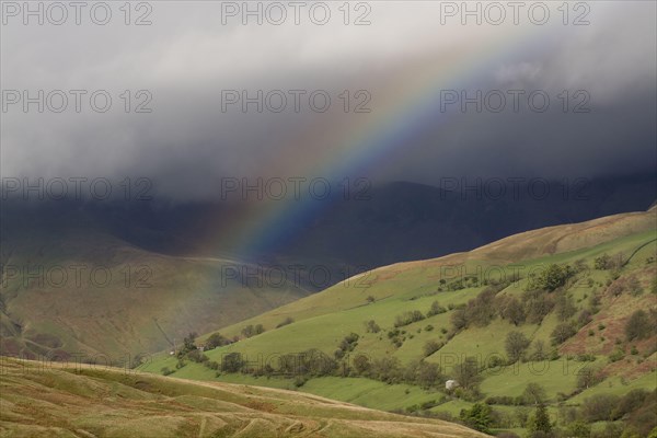 Rainbow forming over the Highlands during a rainstorm