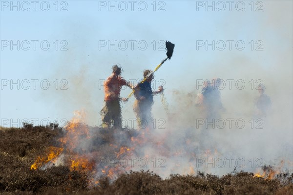 Firefighters tackling heather moor fire on a shooting range that had got out of control