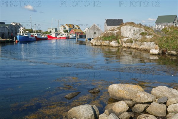 Fishing boats moored in the harbour of the coastal village of Peggys Cove