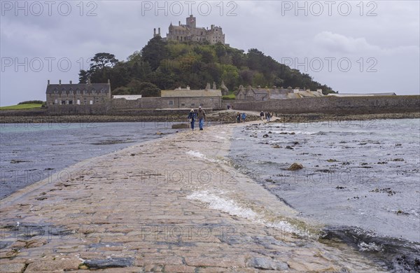 Sea water covering the man-made causeway to the tidal island