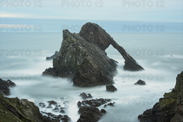 Quartzite sea arch at dusk