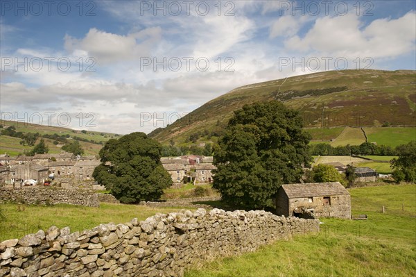 View of dry stone walls and village