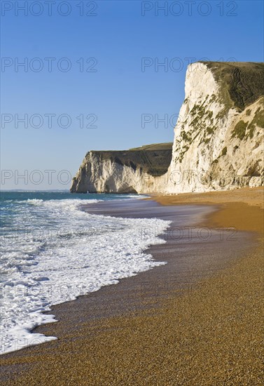 View of chalk cliffs and shingle beach