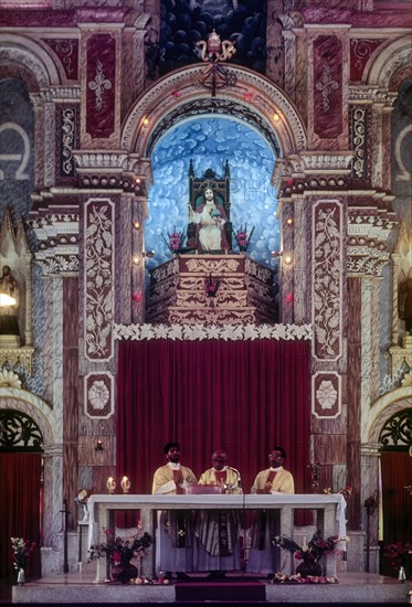 Priest preaching Santa Cruz Basilica in Fort Kochi