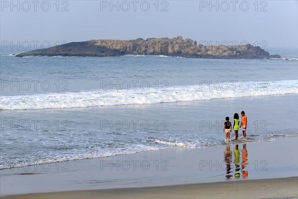 Holidaymakers on the beach of Kovalam