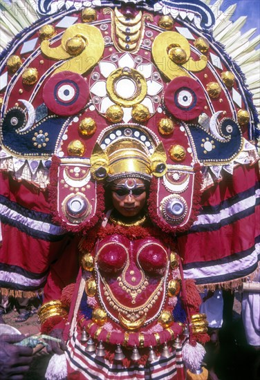 Theyyam dancer in Kavadiyattam in Athachamayam celebration in Thripunithura during Onam near Ernakulam