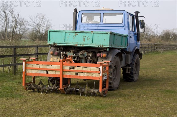 Unimog pulls a Rotavater fan to improve the ground heath