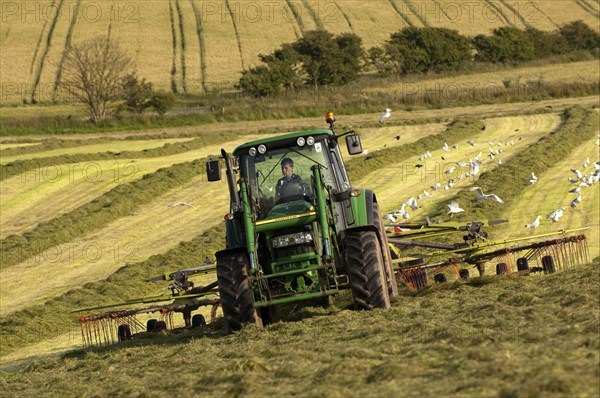 John Deere tractor with tedder