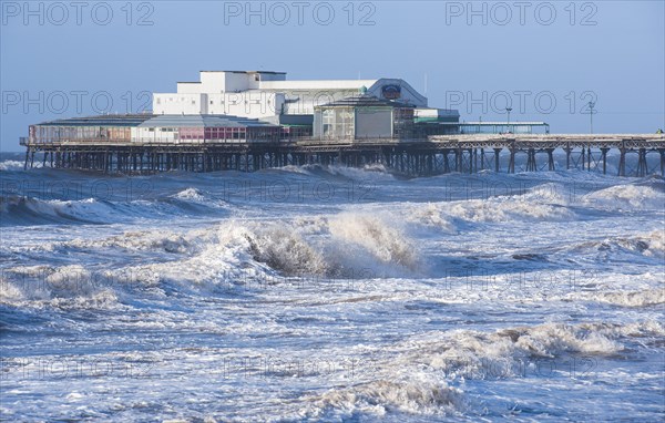 Stormy seas and Victorian pier at the seaside resort