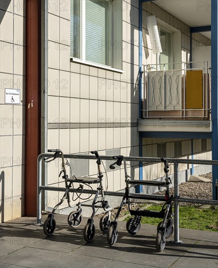 Rollator in front of the entrance to an apartment building in Berlin Mitte