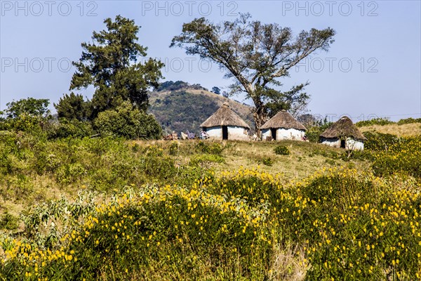 Hilly landscape characterised by the colourful huts
