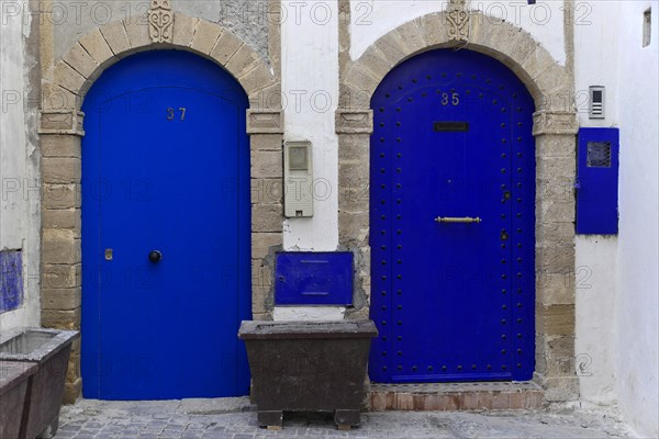 House front with blue entrance door