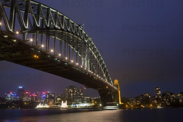 View of bridge and city skyline at night