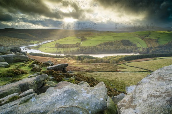 View over cliffs towards reservoir