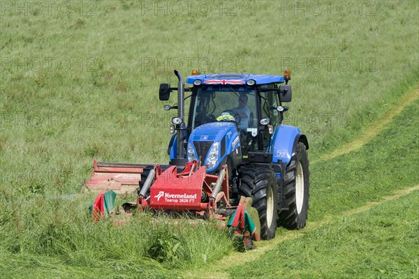 New Holland T7 tractor with Kvernland front and side mower conditioner