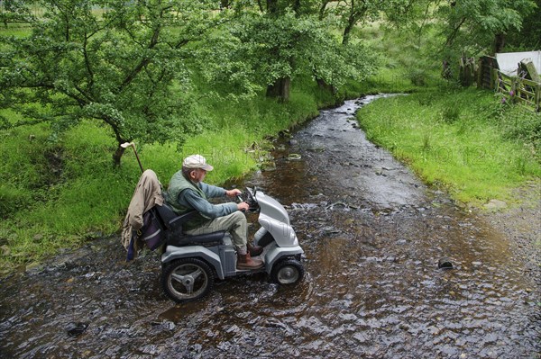 Elderly man with mobility problems visits farm with hitchhiker