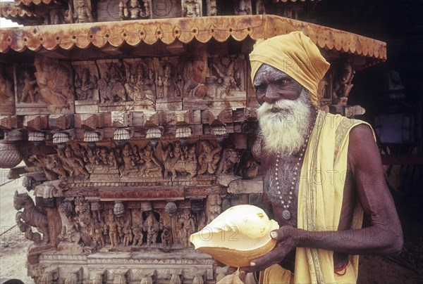 C. Ramasamy â€“ Beggar standing in front of temple chariot