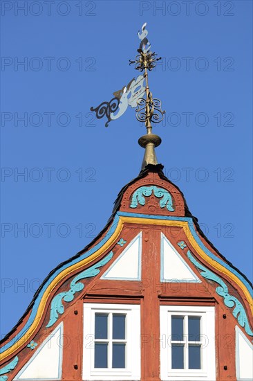 Gable with weather vane of the half-timbered house Zur Pfeif Gasthof on Koenig-Adolf-Platz in Idstein