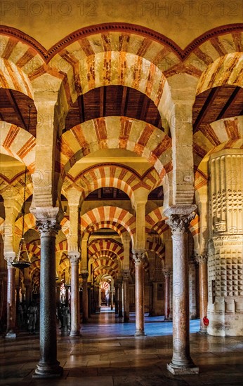 Forest of columns with alternating use of brick and stone and red and white paint