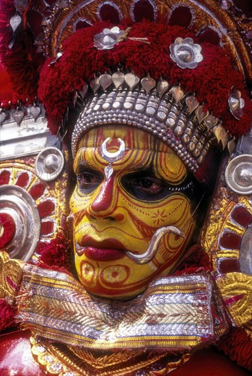 Theyyam dancer in Kavadiyattam in Athachamayam celebration in Thripunithura during Onam near Ernakulam