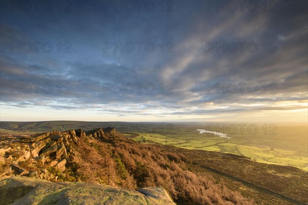 View of the Gritstone escarpment in the afternoon sun