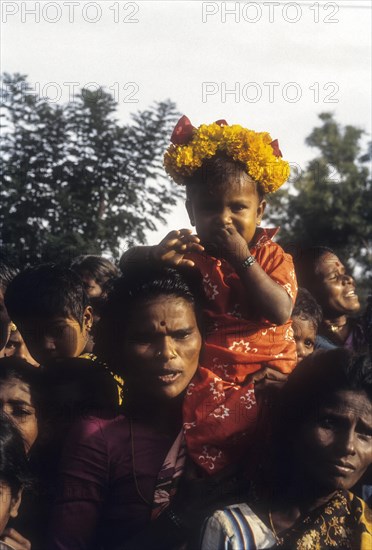 Safely seated village girl