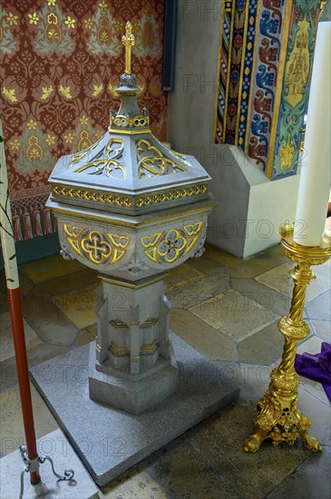 Baptismal font with candle