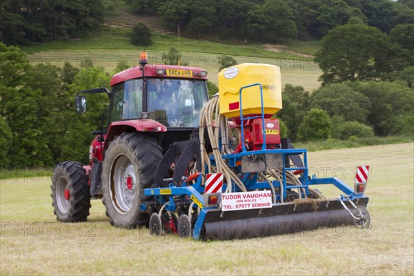 Contractor with McCormick MC120 tractor and ERTH Agriseeder precision slot seeder