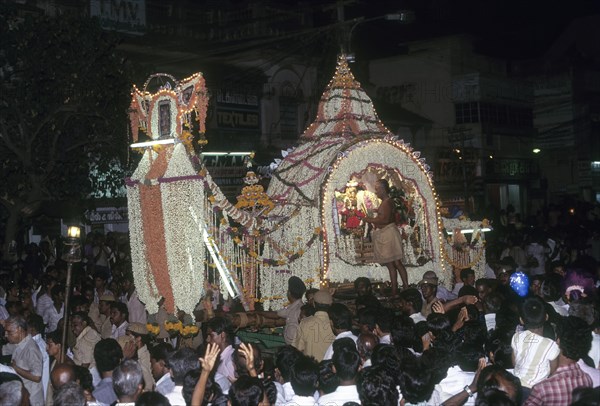 Goddess Meenakshi in a flower Palanquin going in a procession after her wedding