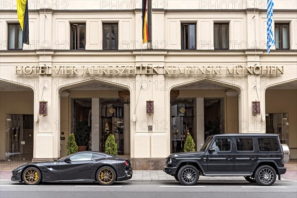 Parked sports car Ferrari F12 Berlinetta and SUV Mercedes-Benz AMG G 63