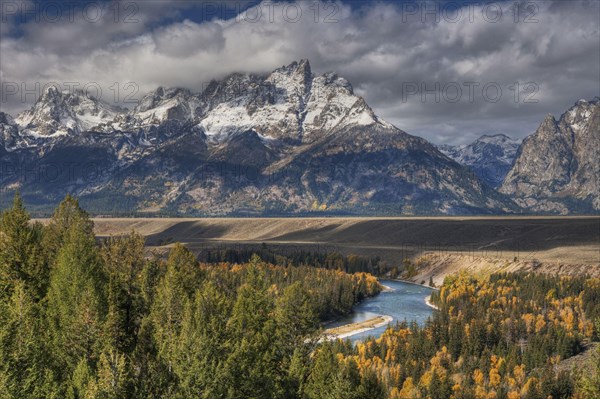 View of mountain range and forested river valley