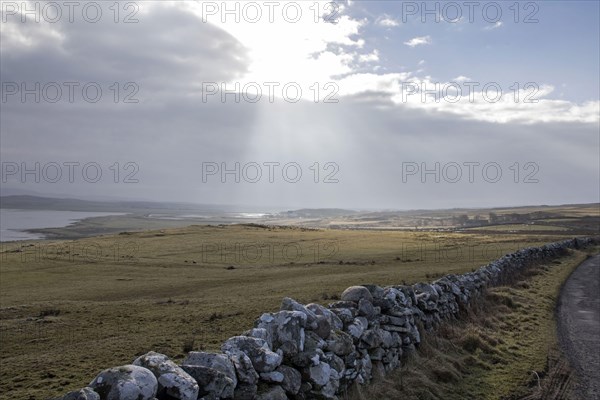 View from the west side of the land along Loch Gruinart. Dry stone wall