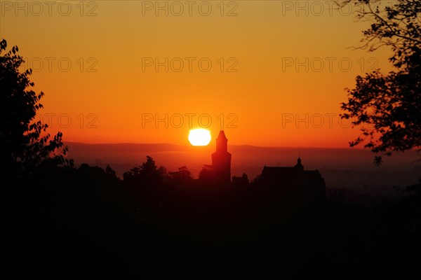 View of the silhouette of Kronberg Castle at sunrise in Kronberg