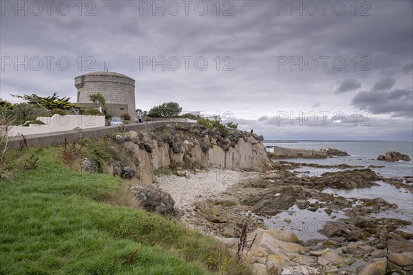 View of coastal promontory and Martello tower