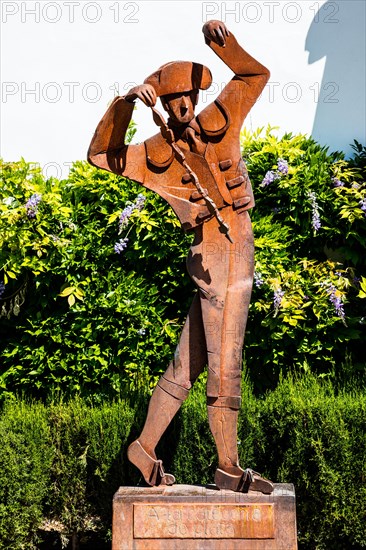 Monument of a torero in front of the bullfighting parade