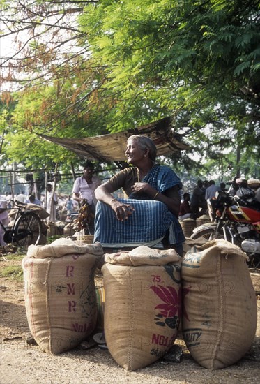 Village woman selling rice in Periodical market in Perundurai near Erode