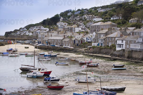 View of boats and fishing village on the coast